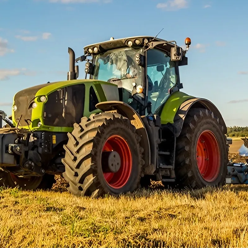 A tractor is plowing A tractor is plowing